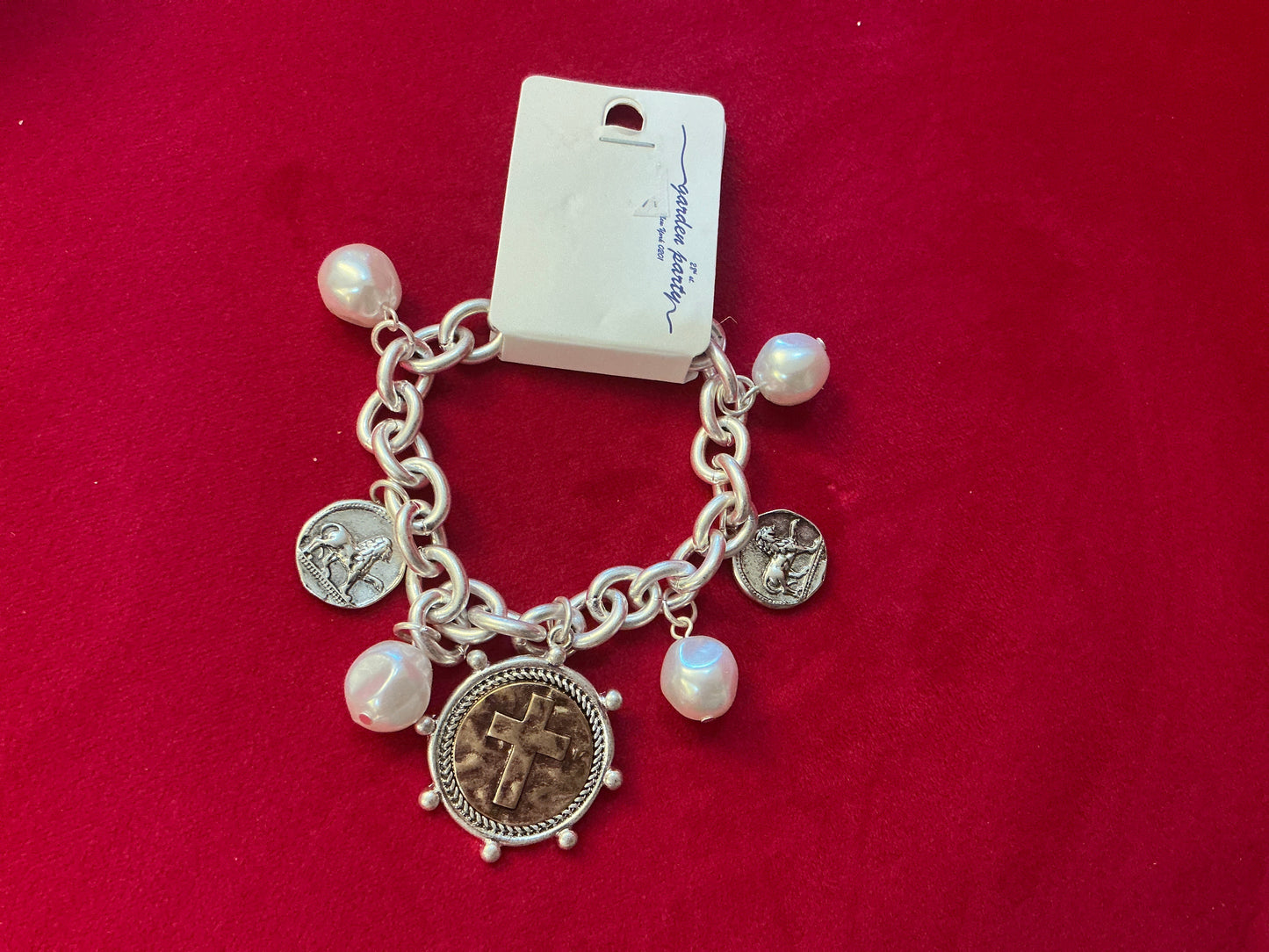 Cross charm bracelet with pearls