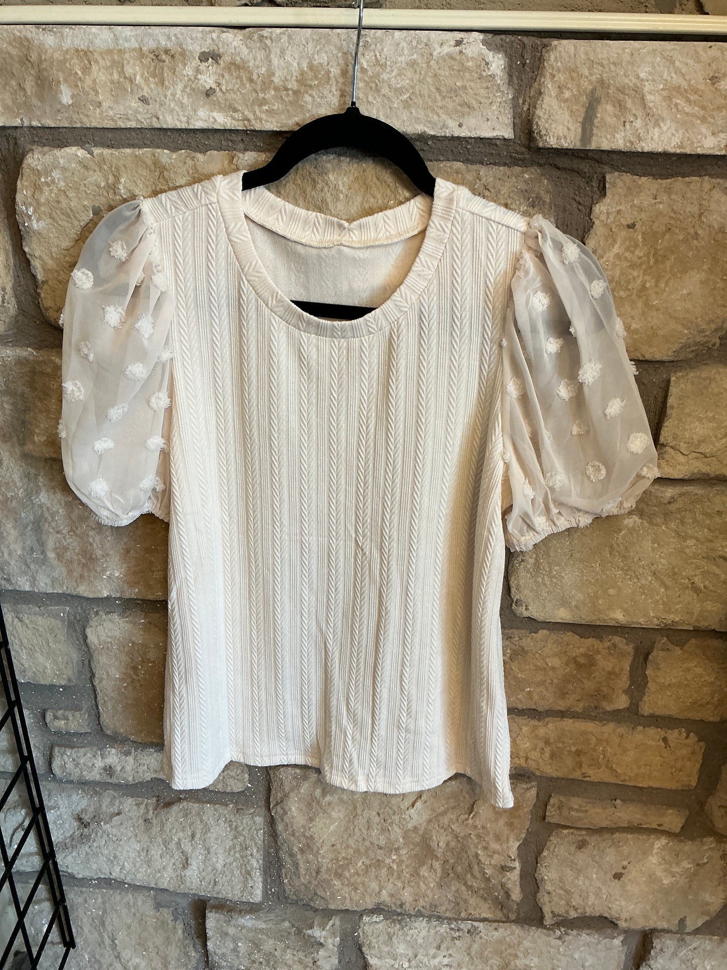 Cream colored sheer dot sleeve knit top