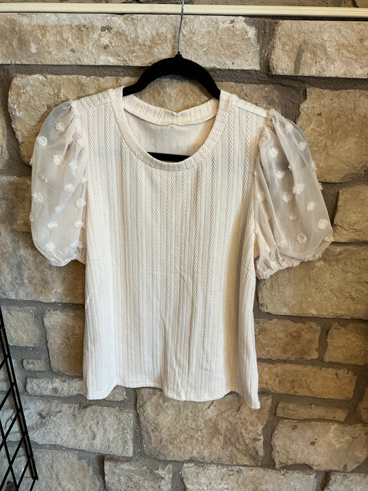 Cream colored sheer dot sleeve knit top