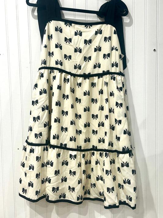 Cream dress black bow detail